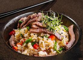 Delectable asian beef fried rice in elegant presentation photo