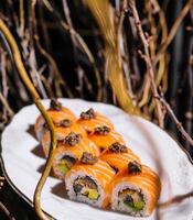 Gourmet salmon sushi with truffle on elegant plate photo