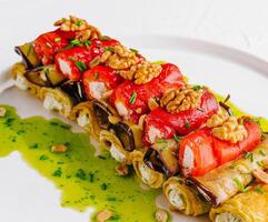 Gourmet stuffed chicken roll with vegetables and nuts photo