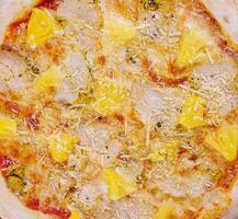 Tasty hawaiian pizza with chicken and pineapple photo