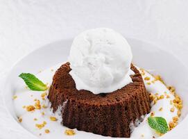 Decadent molten chocolate lava cake with vanilla ice cream photo