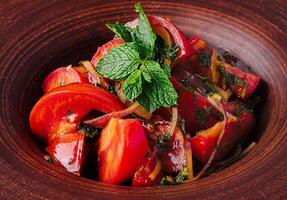 Traditional georgian salad on rustic tableware photo