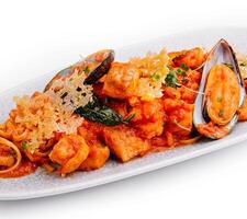 Seafood pasta with tomato sauce and mussels photo