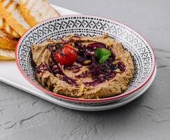 Gourmet homemade hummus with crispy bread photo