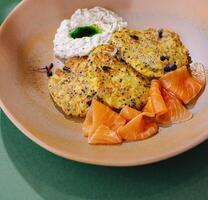 Gourmet smoked salmon with herb pancakes photo