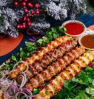 Festive table setting with grilled kebab platter photo
