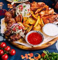 Traditional georgian feast with assorted grilled meats photo