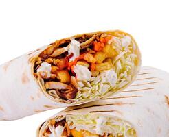 Fresh veggie wrap cut in half on white background photo