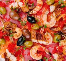 Exquisite seafood platter with shrimp and caviar photo
