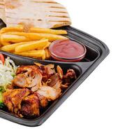 Gyro platter with fresh sides isolated on white photo
