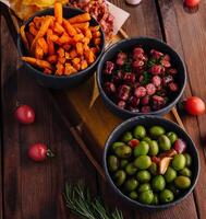 Assorted tapas platter with olives and snacks photo