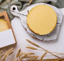 Homemade lemon tart on rustic kitchen setting photo