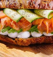 Gourmet smoked salmon sandwich on rustic bread photo