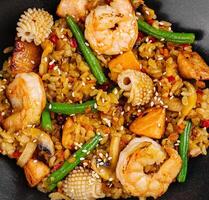 Delicious shrimp stir fry with vegetables and rice photo