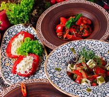 Colorful mediterranean feast on ethnic tableware photo