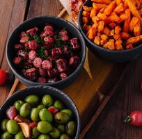 Assorted tapas platter with olives and snacks photo