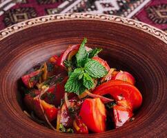 Traditional georgian salad on rustic tableware photo