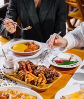 Friends enjoying a feast at a restaurant photo