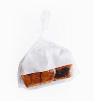 Loaf of bread in plastic bags isolated photo