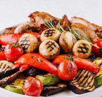 Grilled vegetables and chicken plate photo