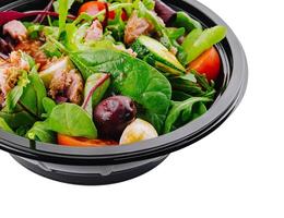 Fresh mixed salad in takeout container photo