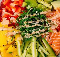 Fresh salmon poke bowl top view photo