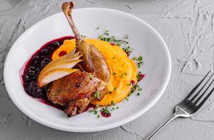 Festive holiday dinner with roasted duck photo