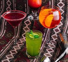 Assorted cocktails on a patterned backdrop photo