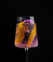 Elegant cocktail with floral garnish photo