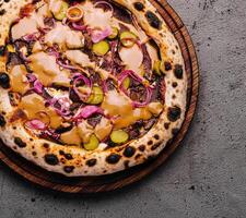 Gourmet vegan pizza on rustic table photo