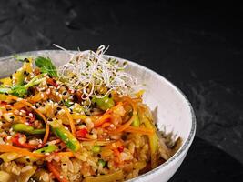 Colorful asian fusion rice bowl close up photo