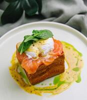 Gourmet smoked salmon toast with poached egg photo