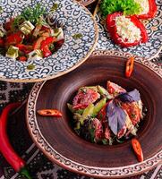 Colorful mediterranean feast on ethnic tableware photo