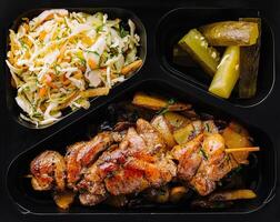 Grilled chicken meal prep in container photo