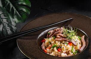 Delectable asian beef fried rice in elegant presentation photo