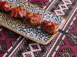 Turkish kebab on decorative plate photo