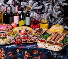 Festive holiday dinner table spread with various dishes photo