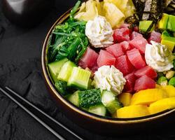 Fresh poke bowl with tuna and vegetables photo