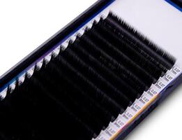 Eyelash extension trays on white background photo