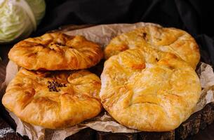 Freshly baked traditional Romanian cabbage pies photo