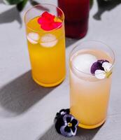 Refreshing summer drinks with floral garnish photo