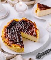 Traditional basque burnt san sebastian cheesecake slice on elegant table setting photo