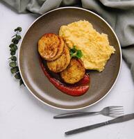 Plate with mashed potatoes and vegetable cutlets top view photo