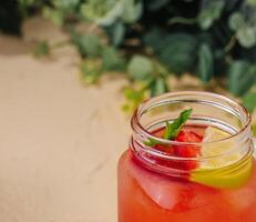 Refreshing strawberry lemonade in mason jar photo