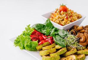 Fresh vegan meal assortment on white photo