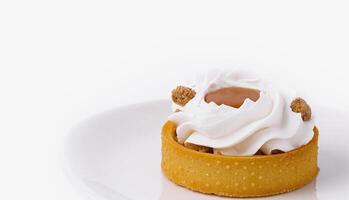 Elegant tartlet with whipped cream on white plate photo