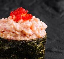 Gourmet spicy tuna sushi with red caviar photo