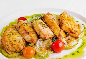 Grilled chicken breast with roasted vegetables plate photo