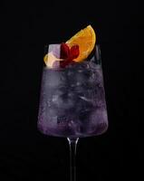 Elegant cocktail with purple tint and garnish photo