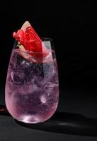 Elegant pink cocktail with grapefruit garnish photo